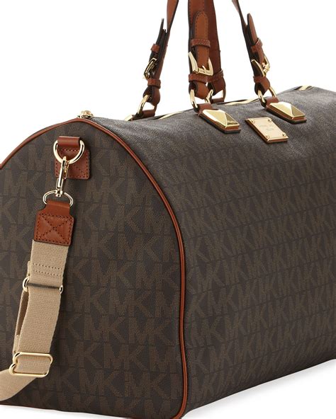 black michael kors duffle bag|michael kors travel suitcase.